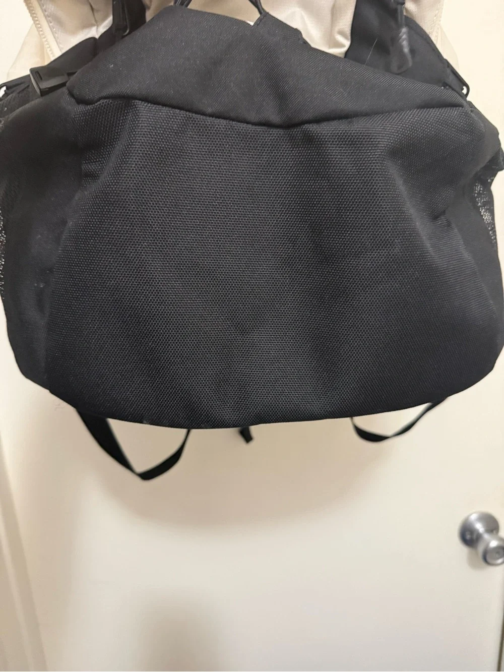 The North Face Two-Tone Beige and Black Backpack with Bungee Front